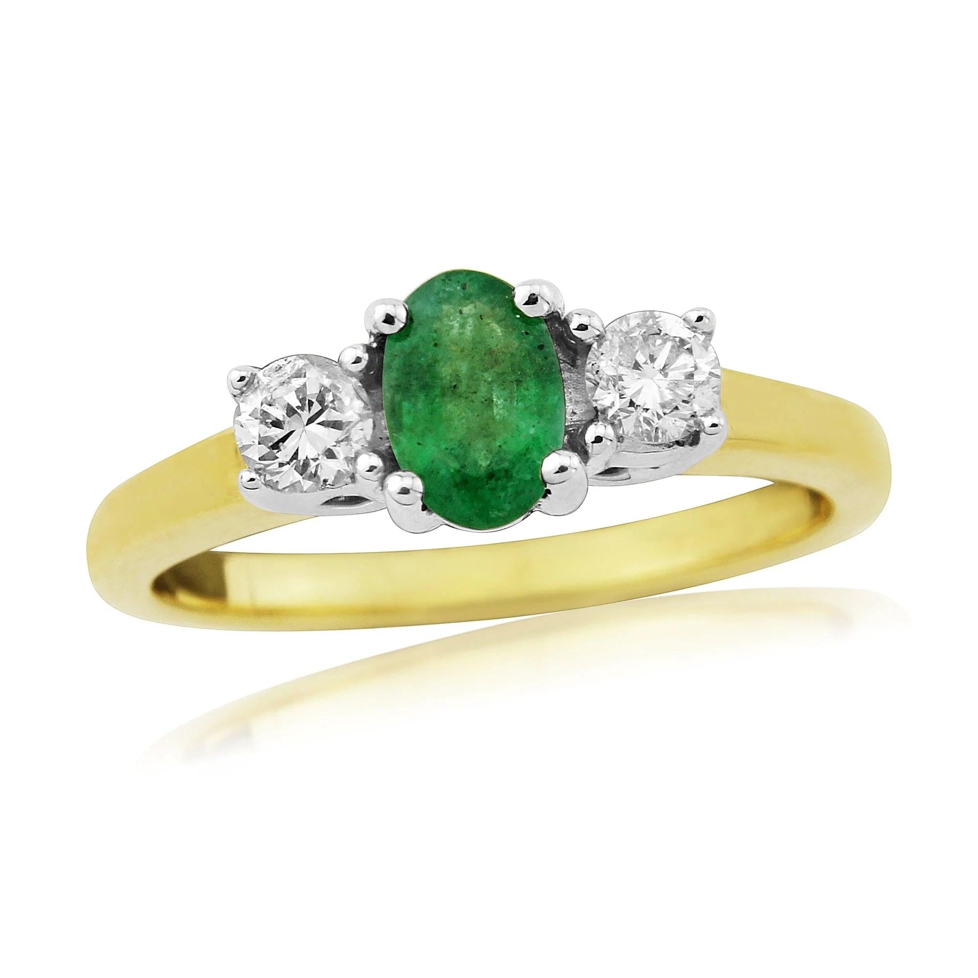18ct Yellow Gold ovl emrld + rbc dia 3-st clw set ring