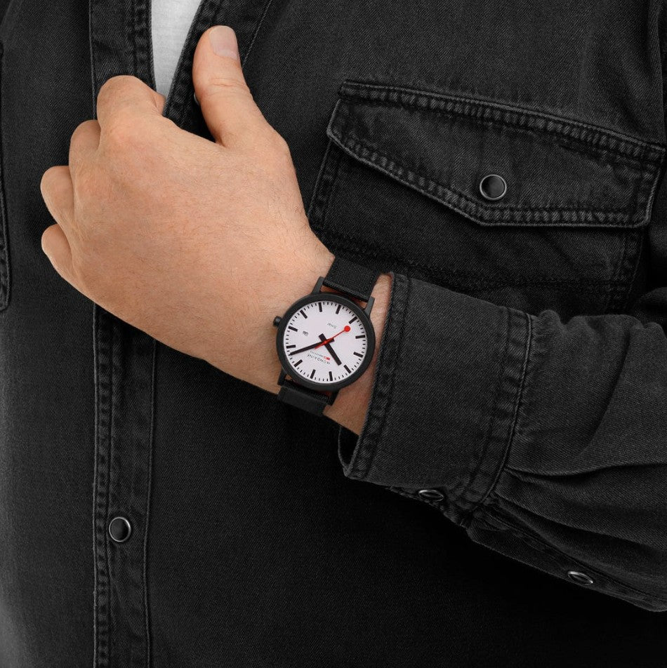 Mondaine Essence Solar Watch. White Dial, Black Textile Strap.