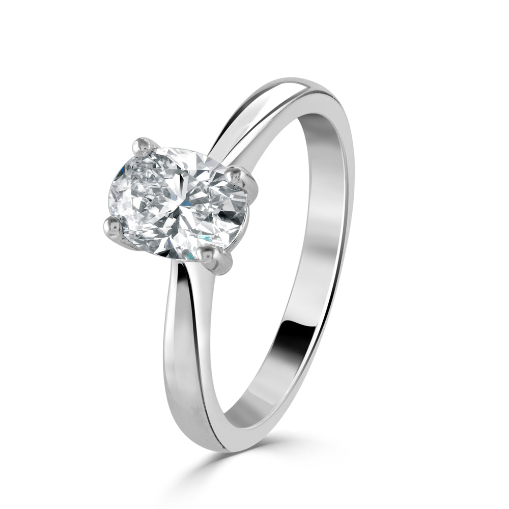 Platinum oval cut solitaire claw set diamond ring