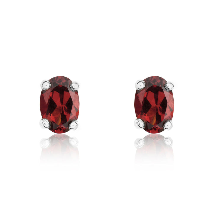 9ct white gold 6x4mm oval garnet claw set stud earrings